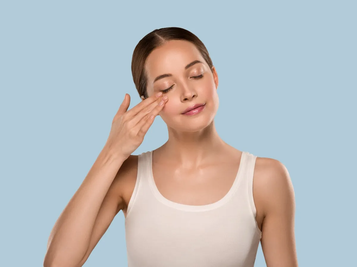 A Female touching her smooth skin after Timeless Radiance Experience program at Vertex Aesthetics in Toronto