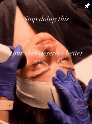 Client receiving a professional skincare treatment with a device from a gloved specialist.
